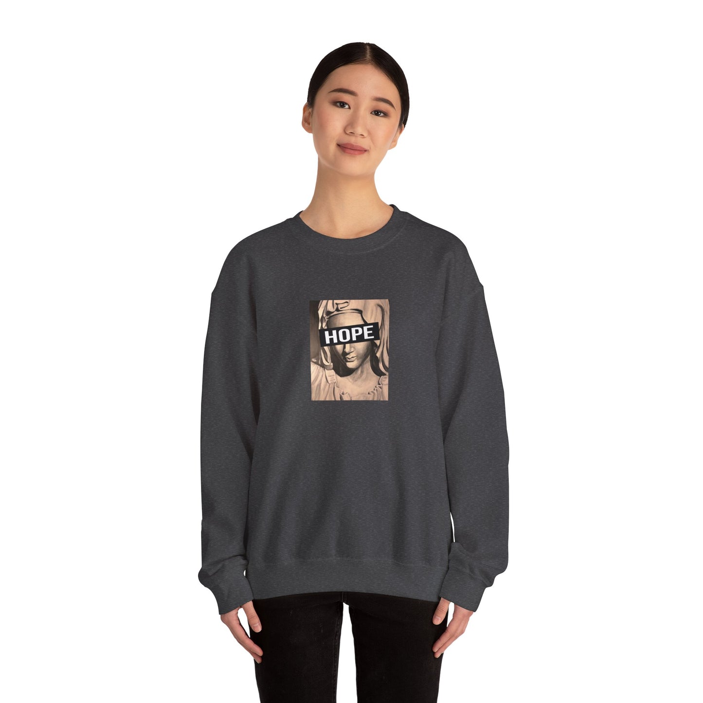 woman wearing dark heather crewneck sweatshirt with a graphic print of a person's face and the word 'HOPE' on the front, front
