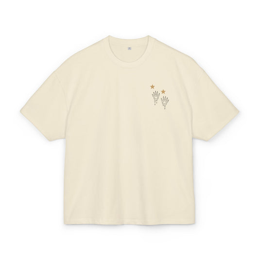 sand t-shirt with small graphic raccoon prints and stars on a white background, front