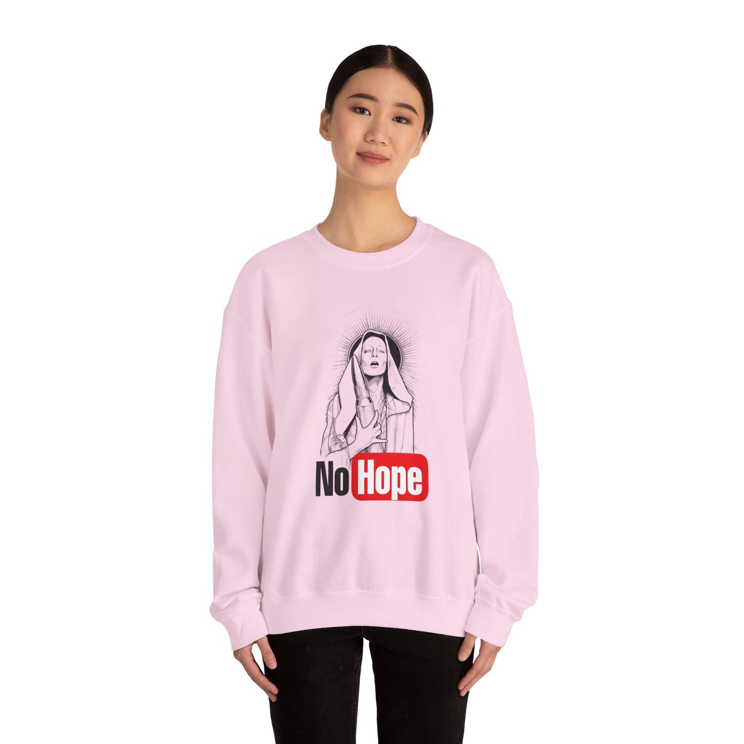 woman wearing light pink crewneck sweatshirt with a graphic print of a person and the text 'No Hope' on the front, front