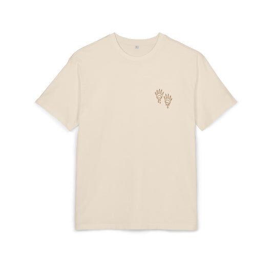 sand t-shirt with small raccoon paw print design on a white background, front