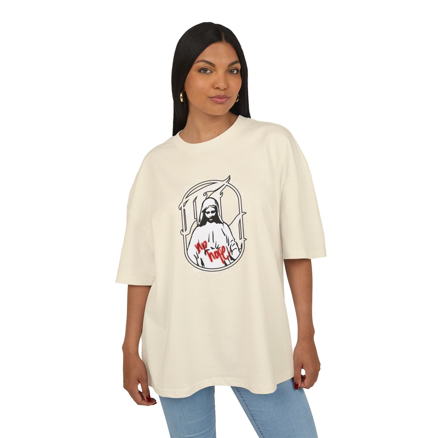 Woman wearing a sand t-shirt with a graphic design on a white background, front