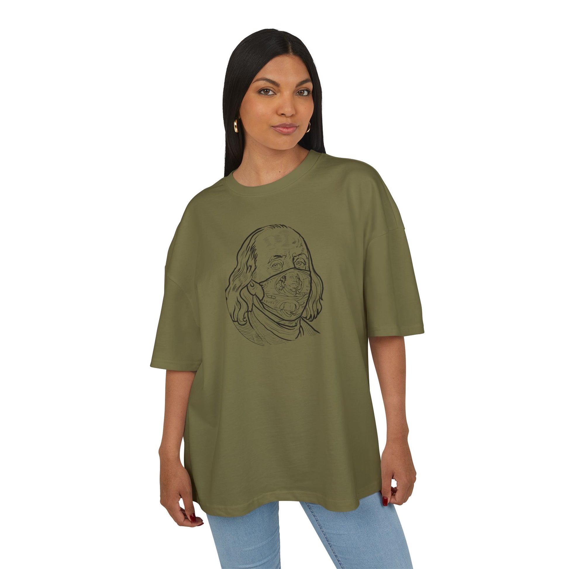 Woman wearing a olive green t-shirt with a graphic design on a white background, front