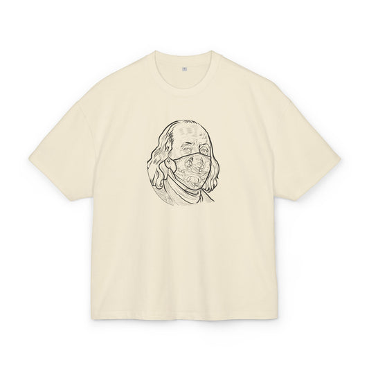 Sand t-shirt with a graphic of a face wearing a mask on a white background, front